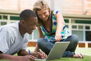 students use laptop to search for scholarships